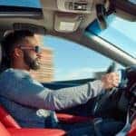 Cool guy driving his 2018 Toyota Camry in for service