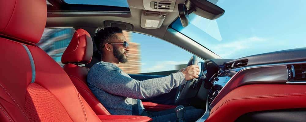 Cool guy driving his 2018 Toyota Camry in for service