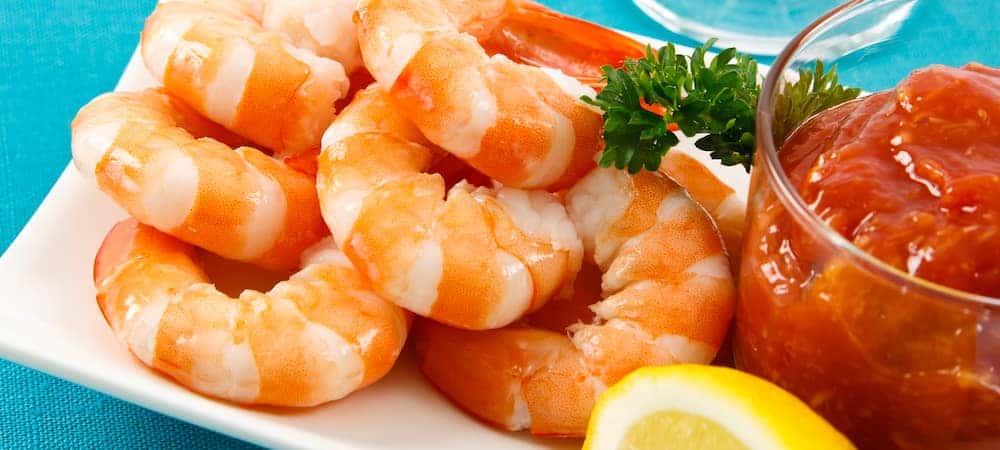 Fresh shrimp on an aqua background