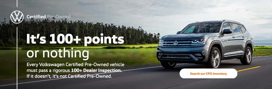 Volkswagen Certified Pre-Owned SUV driving on a scenic highway with text overlay promoting 100+ point dealer inspection and a call-to-action to search CPO inventory.