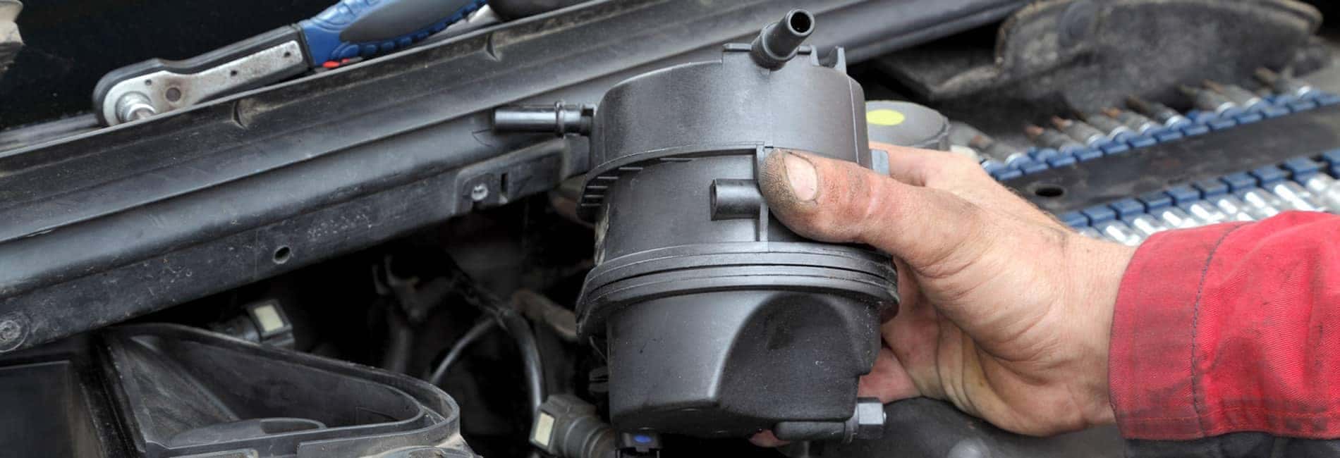 service-tech-working-on-a-vehicle