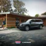A woman walking towards a 2021 Honda Pilot