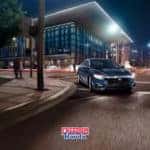 Honda Insight sedan driving at night