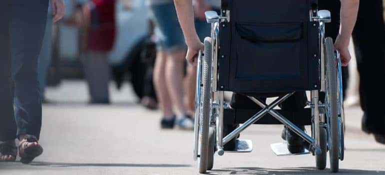 Behind someone in Wheel chair
