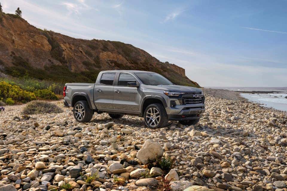 Chevy Silverado 1500 parked on rocky shore of beach from Chevrolet Dealer near Conyers GA