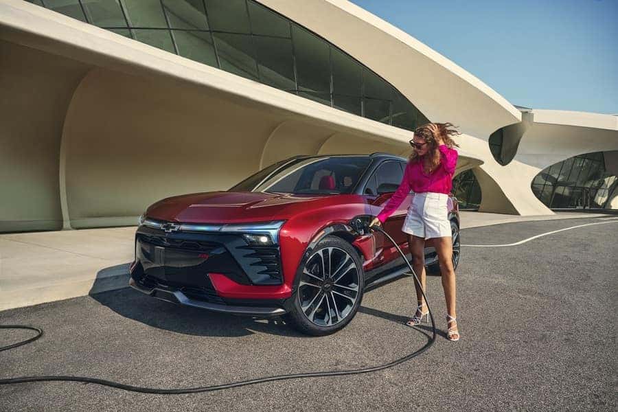 Woman charging Chevrolet Blazer EV from Chevy dealer near Monroe GA