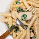 Overhead shot of penne pasts with chicken and white sauce