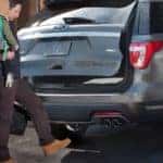 Family entering Ford Explorer