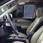 2020 Ford Explorer front seats with driver's side door open.