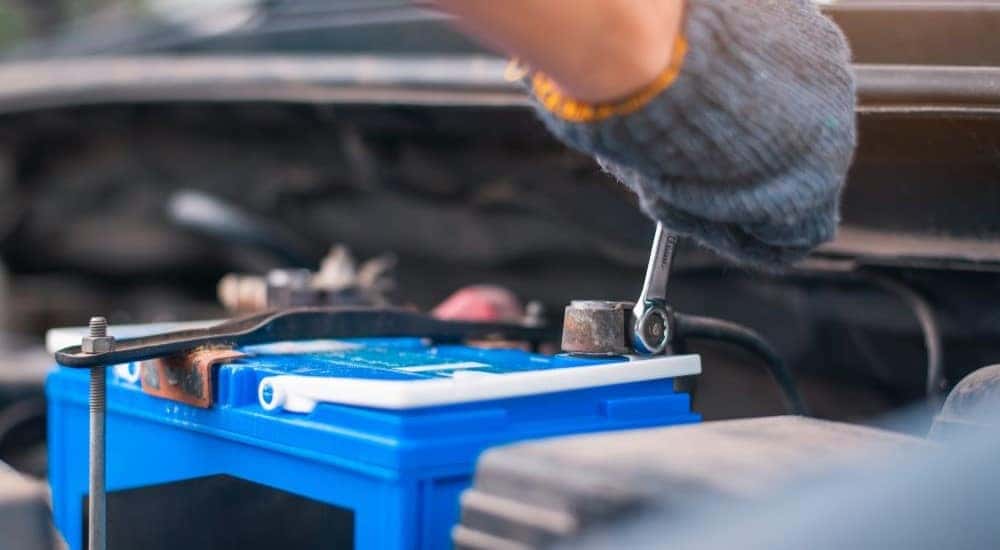 A mechanic is shown installing one of the most popular Toyota TrueStart batteries.