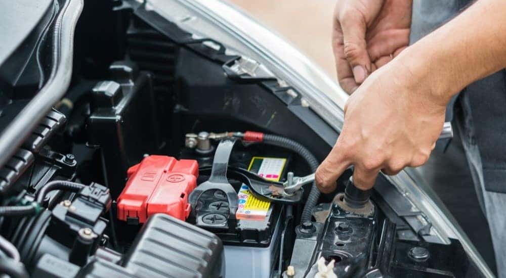 A mechanic is shown installing one of most popular Toyota TrueStart batteries.