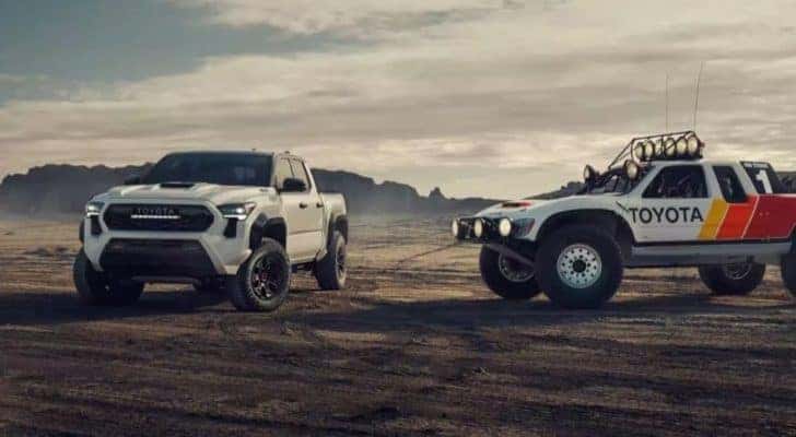 A white 2024 Toyota Tacoma TRD Pro is shown parked off-road.