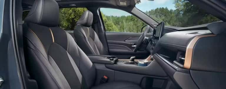 The black front seats are shown in a 2024 Toyota Grand Highlander.