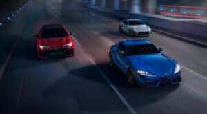 A blue 2025 Toyota GR Supra Premium, a white GR86 Premium, and a red GR Corolla Premium Plus are shown driving.