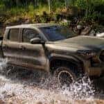A brown 2025 Toyota Tacoma TRD Pro is shown from the side.