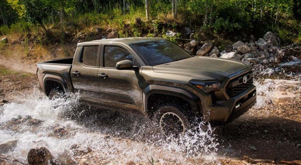 A brown 2025 Toyota Tacoma for sale is shown from the side.