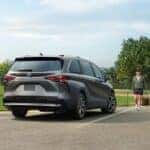 A gray 2025 Toyota Sienna parked near baseball field