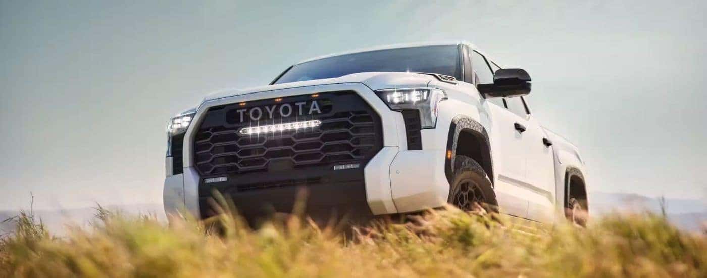 A white 2022 Toyota Tundra is shown from the front at an angle after leaving a Toyota Tundra dealer.