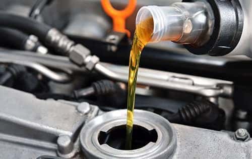 Oil pouring into open spot on the engine (1)