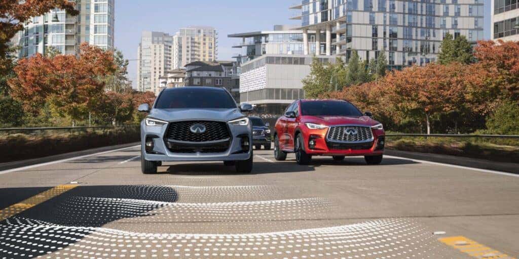 Two INFINITI QX50s driving side by side