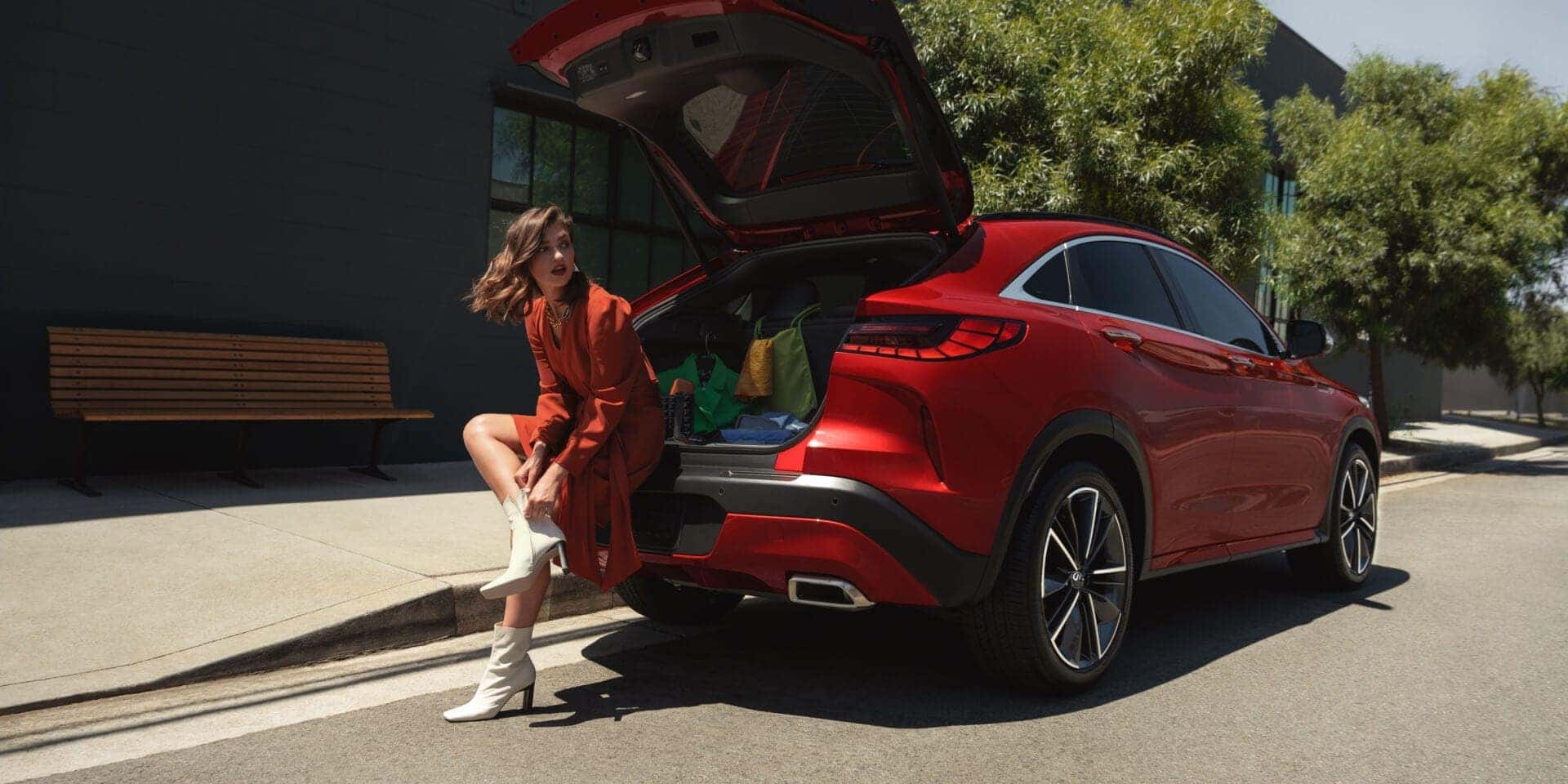 INFINITI QX55 parked near modern architecture