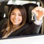 Woman smiling and holding her car keys