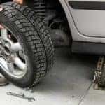Man Changing a Car Tire