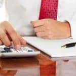 Man using a calculator