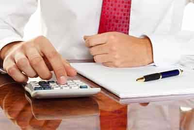 Man using a calculator