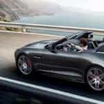 2020 F-TYPE Checkered Flag Convertible in gray driving on coastal highway