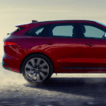 2020 jaguar f-pace red exterior shot driving