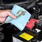 Auto Mechanic Checking Oil
