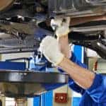 man working under car