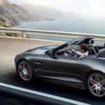 2020 Jaguar F-TYPE Checkered Flag Convertible in gray driving on coastal highway