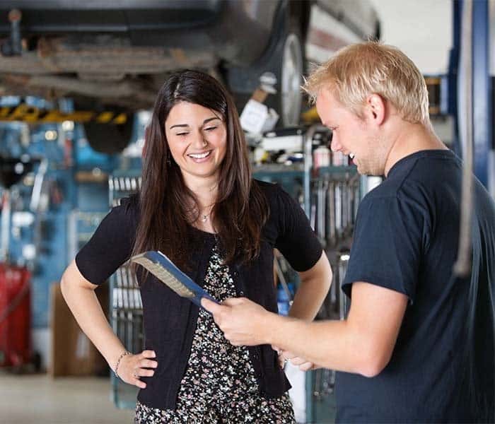 Mechanic talking to a woman