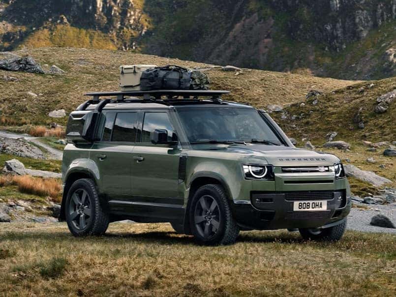 Defender parked in off-road grassy area