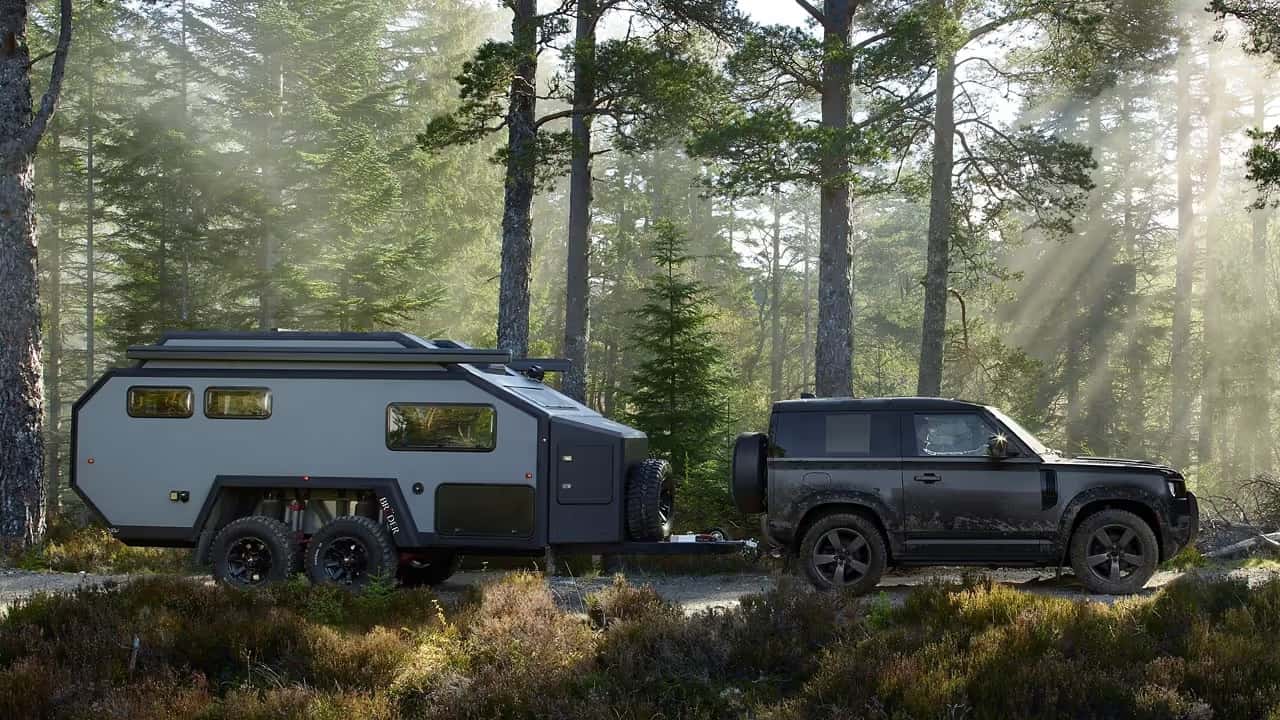 2026 Defender 90 towing a camper