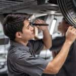 Land rover service tech checking tread depth