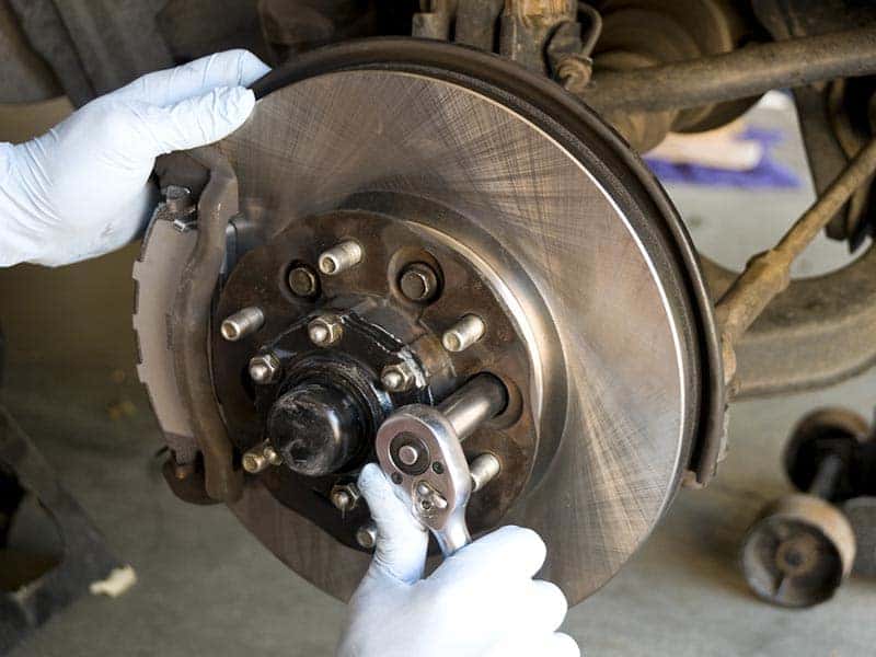 Mechanic performing brake repair