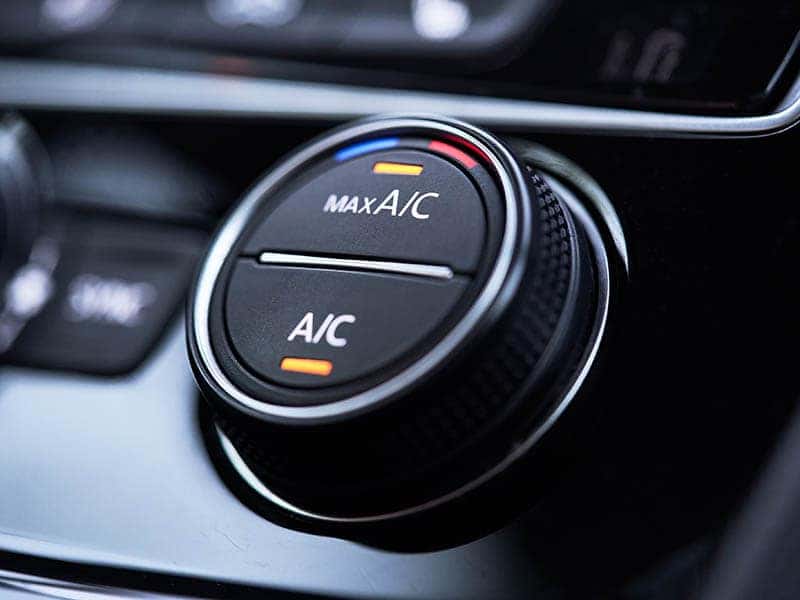 Dash button displaying AC and Max AC options lighted up.
