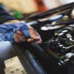 mechanic working under hood