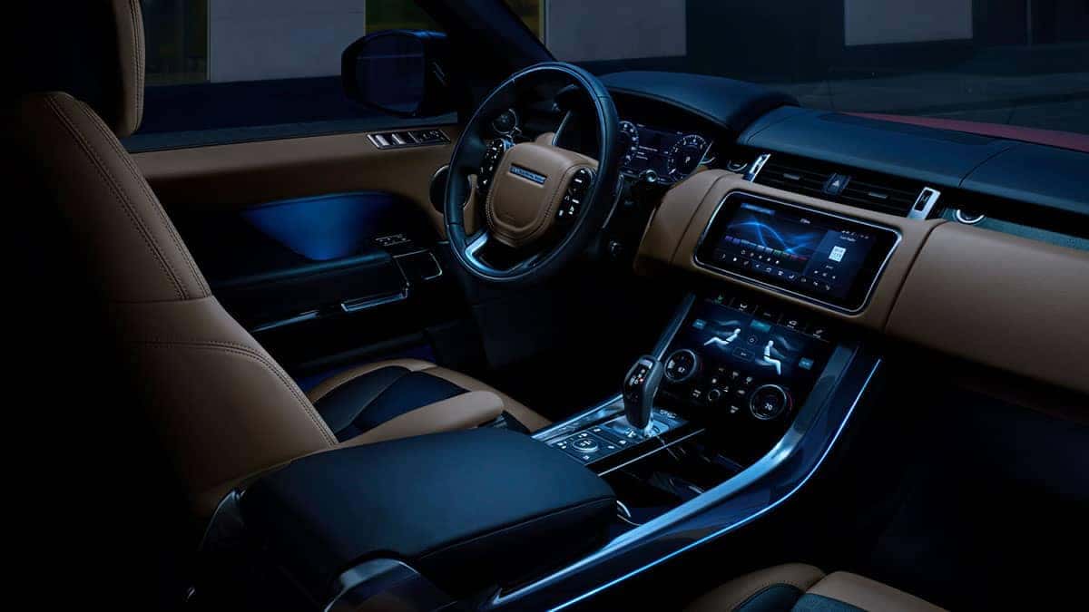 2019 Land Rover Range Rover Sport Interior Front Seating and Dashboard at Night