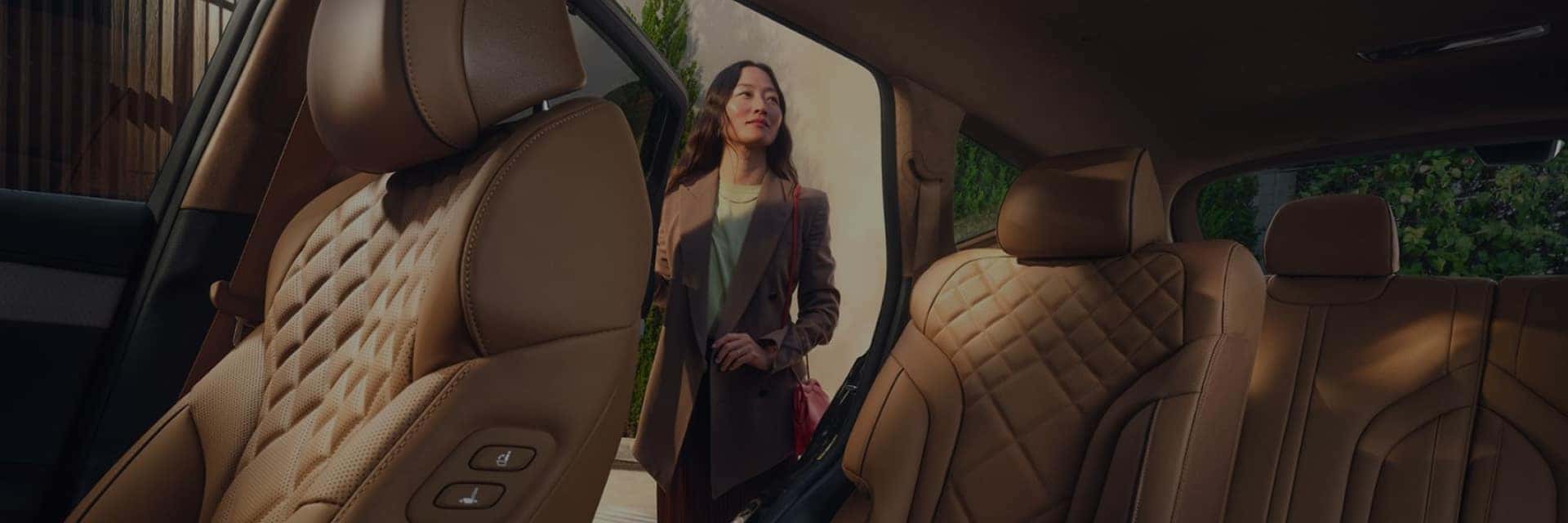 woman next to genesis gv80