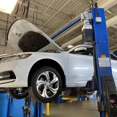 An interior shot of a person driving a Honda SUV