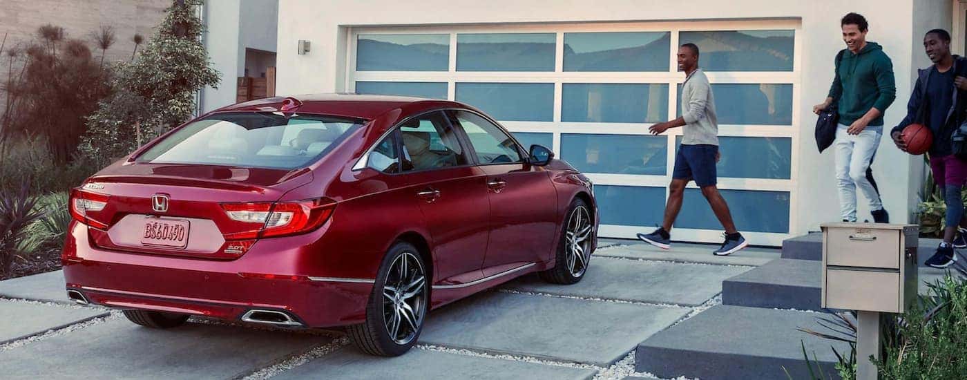 A red 2021 Honda Accord from the rear.