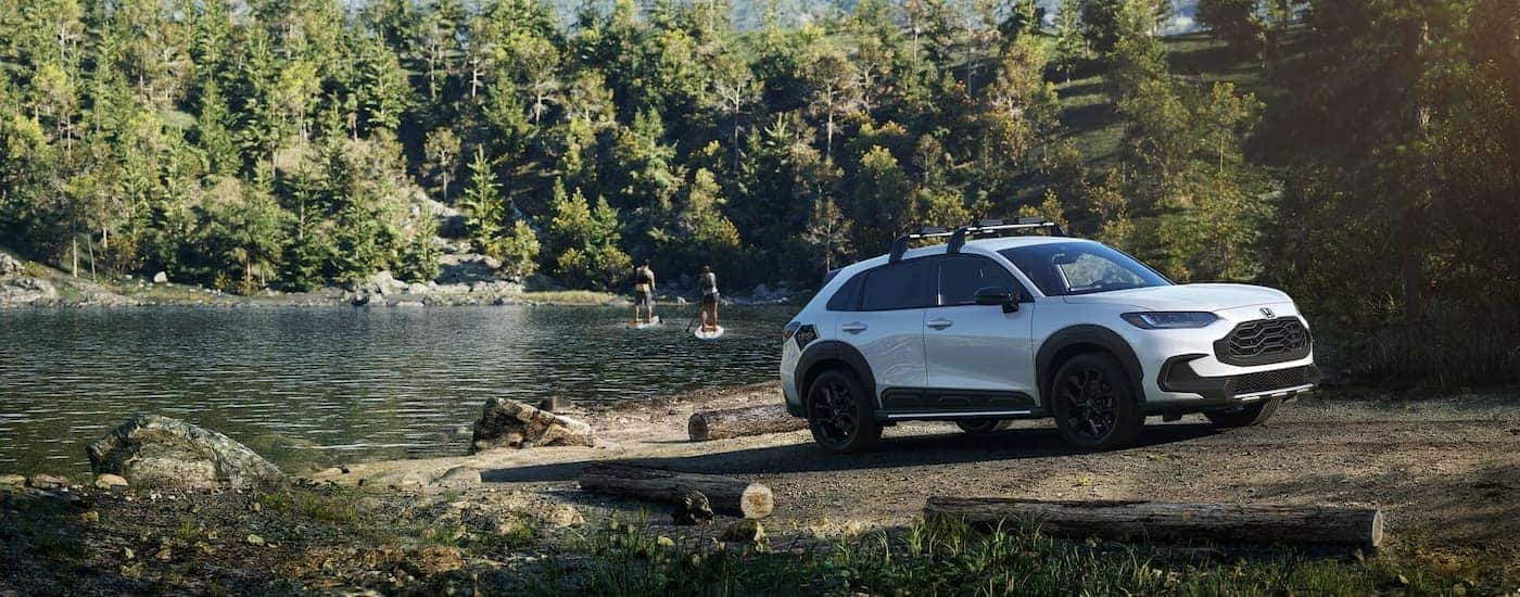 White 2025 Honda HR-V parked near a lake