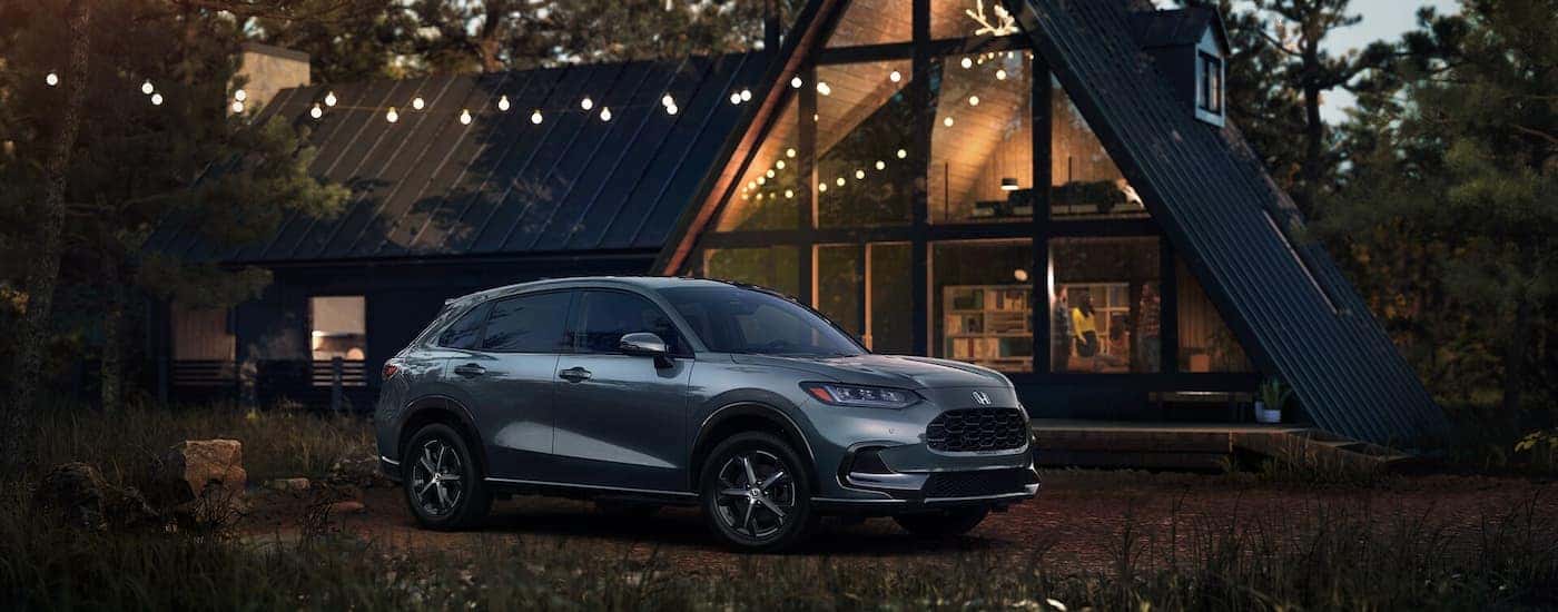 Gray 2025 Honda HR-V parked outside a cabin