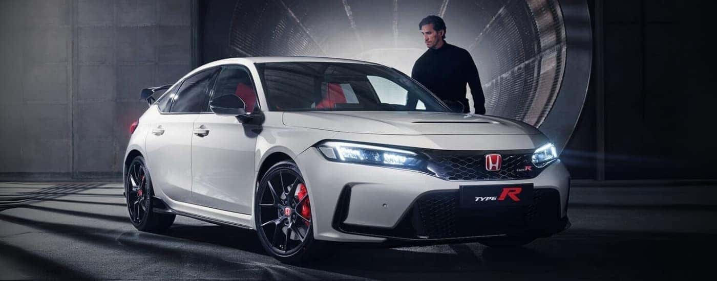 A person is shown near a white 2023 Honda Civic Type R after leaving a Honda dealer near East Hartford.