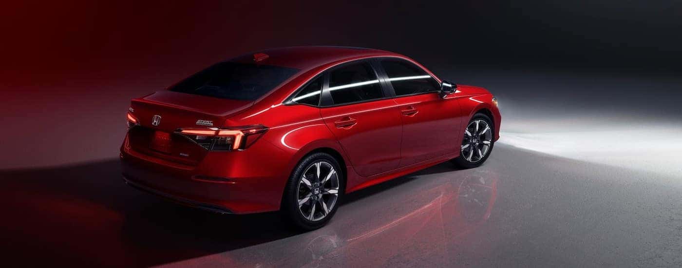 A red 2025 Honda Civic from the rear at an angle.