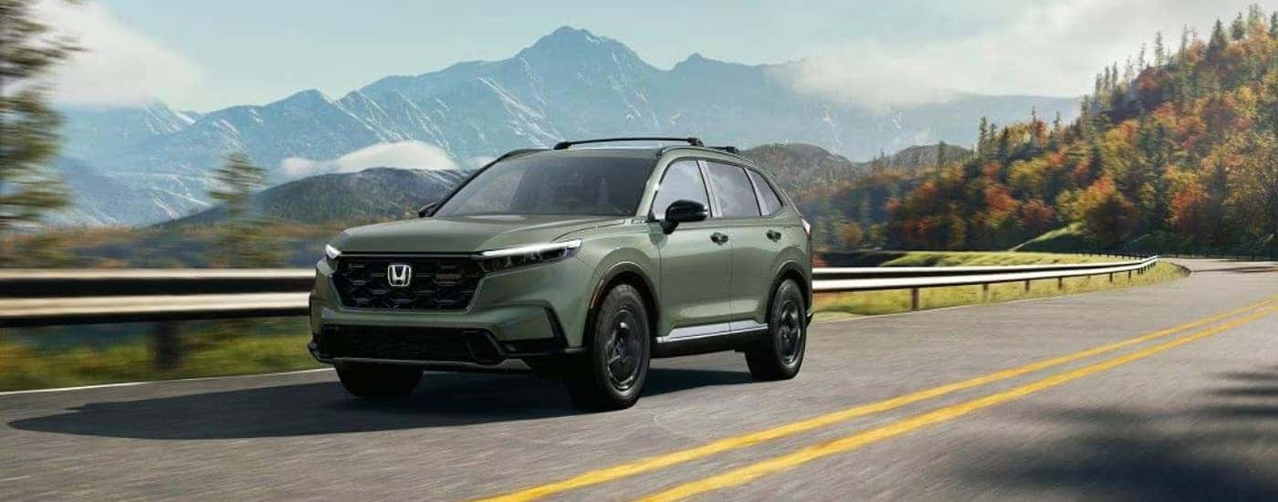 A green 2025 Honda CR-V from the front.